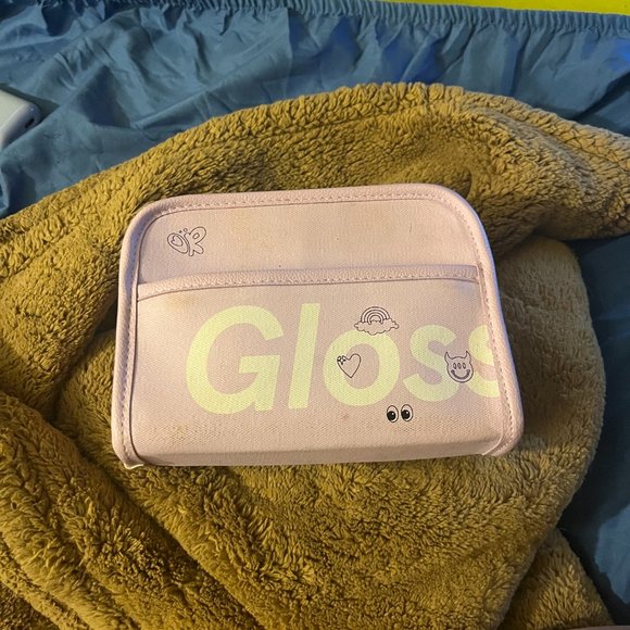 Olivia x Glossier makeup bag for those who don't want to go